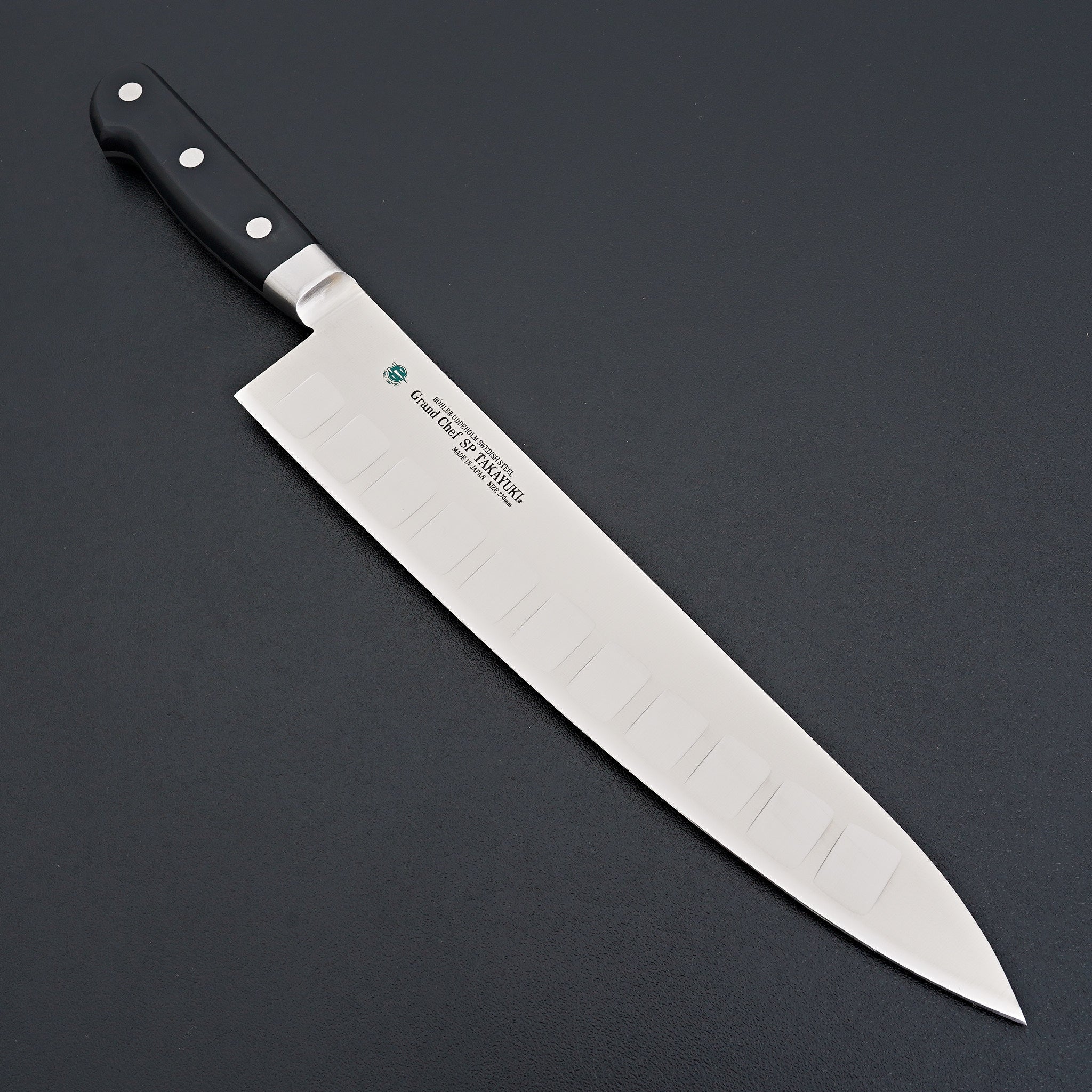 http://carbonknifeco.com/cdn/shop/files/Sakai-Takayuki-Grand-Chef-SP-Gyuto-270mm-Knife.jpg?v=1702120195
